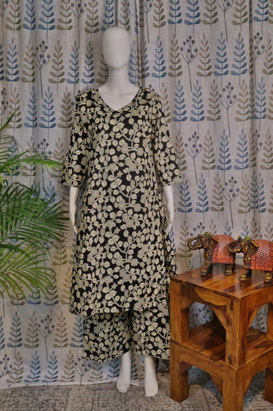 Front view of black cotton quad set with floral printed top and pant