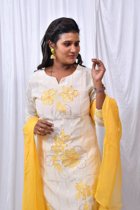 Function Wear 3-Piece Set in Ivory Background with beautiful Yellow Flower designs in Top and Dupatta made out of German Silk