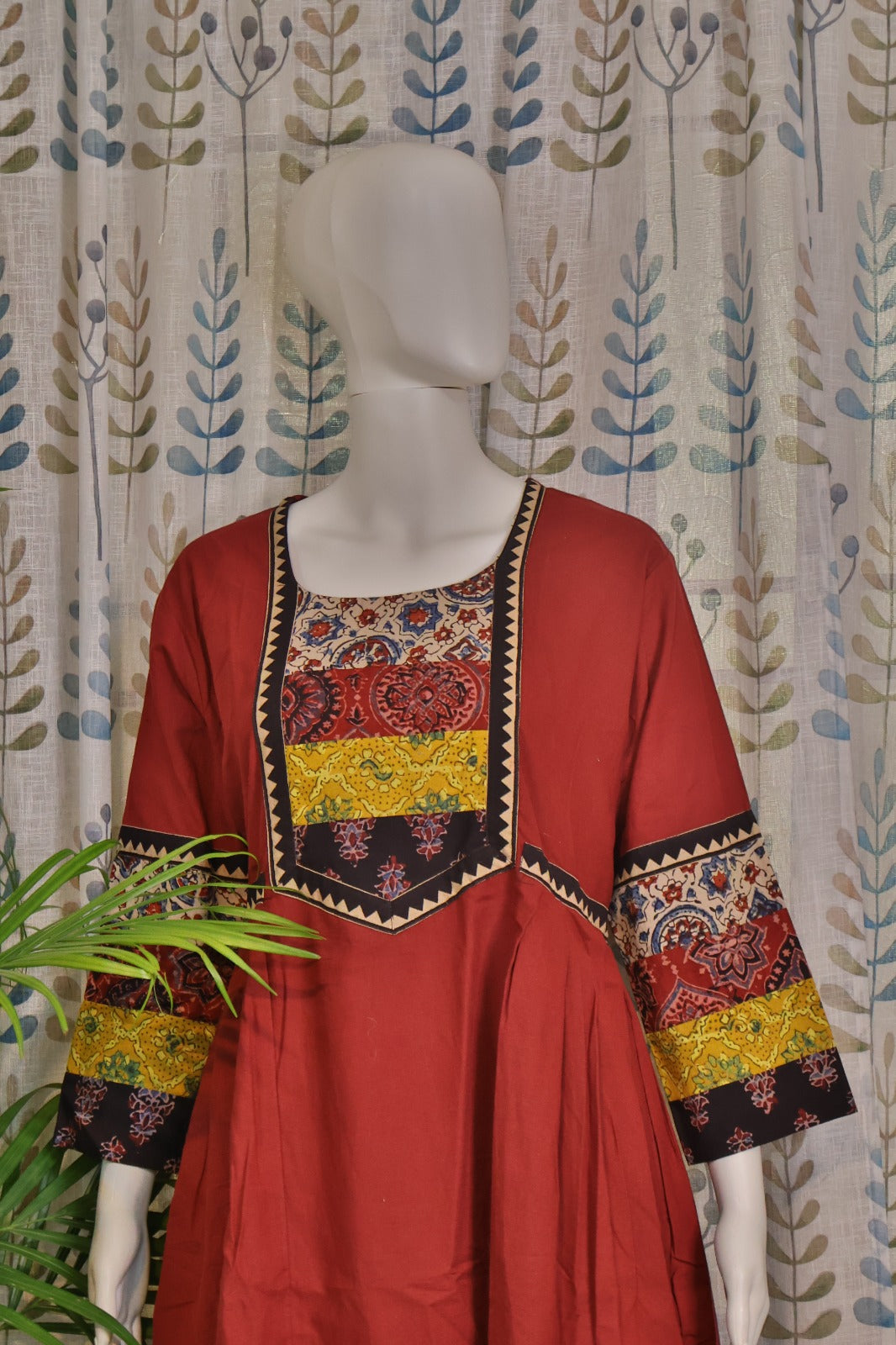 Ethnic maroon frock-style kurti featuring traditional ajarakh design