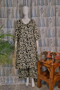 Front view of black cotton quad set with floral printed top and pant