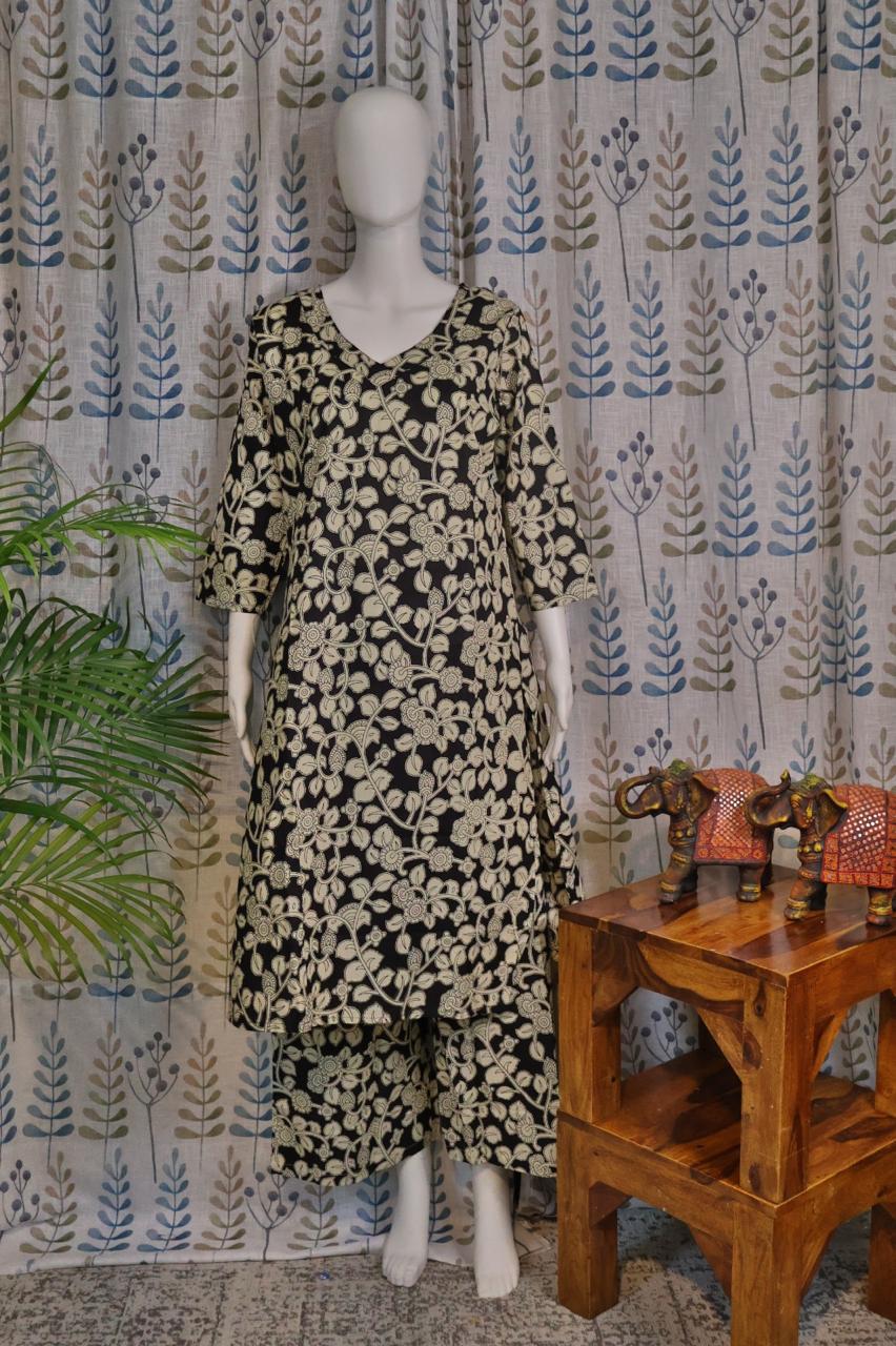 Front view of black cotton quad set with floral printed top and pant