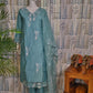 Front view of blue silk cotton kurti set with embroidery on neck and sleeves, paired with organza embroidered dupatta and matching pants.