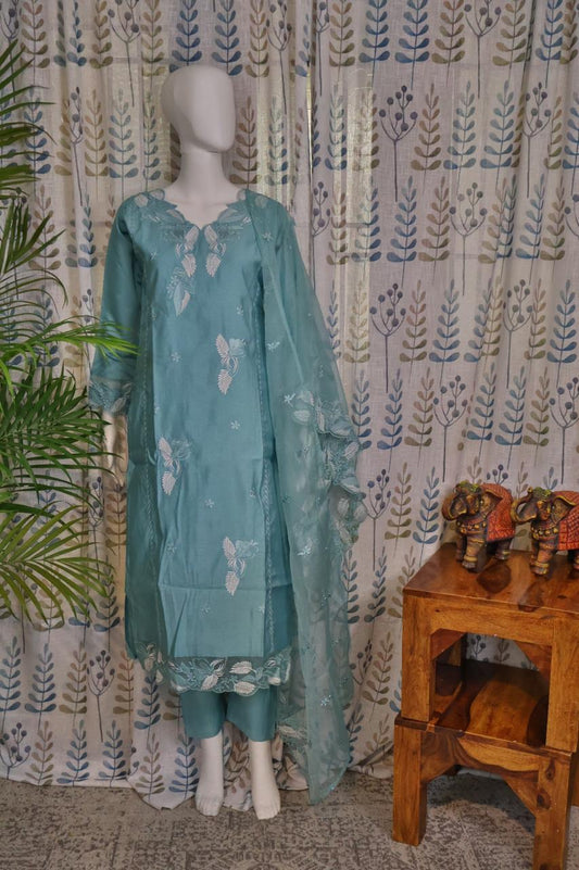 Front view of blue silk cotton kurti set with embroidery on neck and sleeves, paired with organza embroidered dupatta and matching pants.