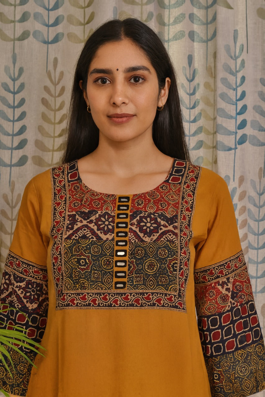 Traditional yellow kurti in khadi cotton with ajarakh print on yoke and sleeves