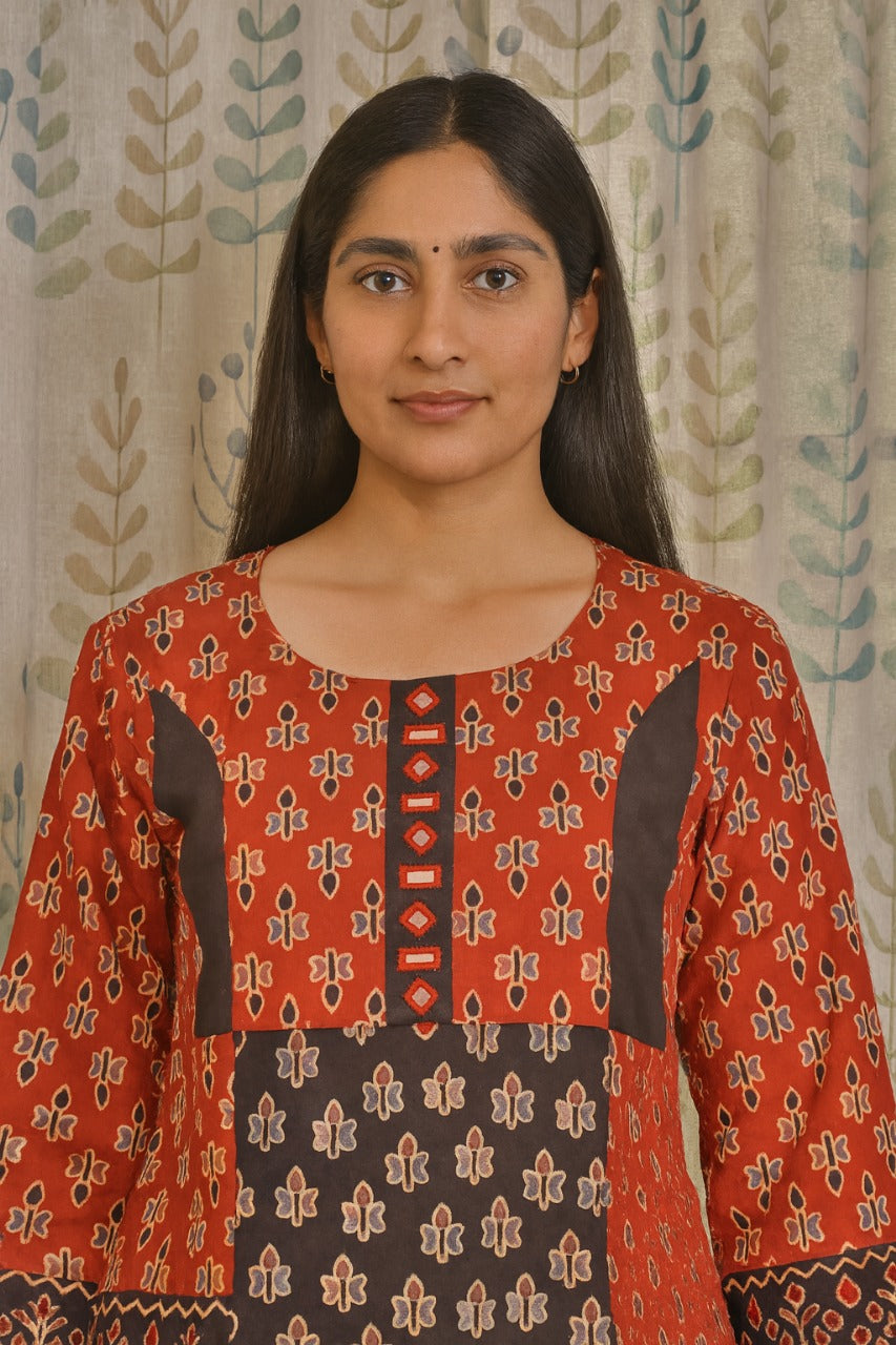 Cotton kurti featuring traditional ajarakh motifs with mirror embellishments