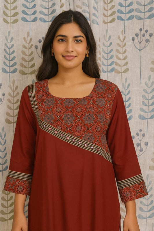 Women's maroon cotton kurti styled with traditional ajarakh motifs