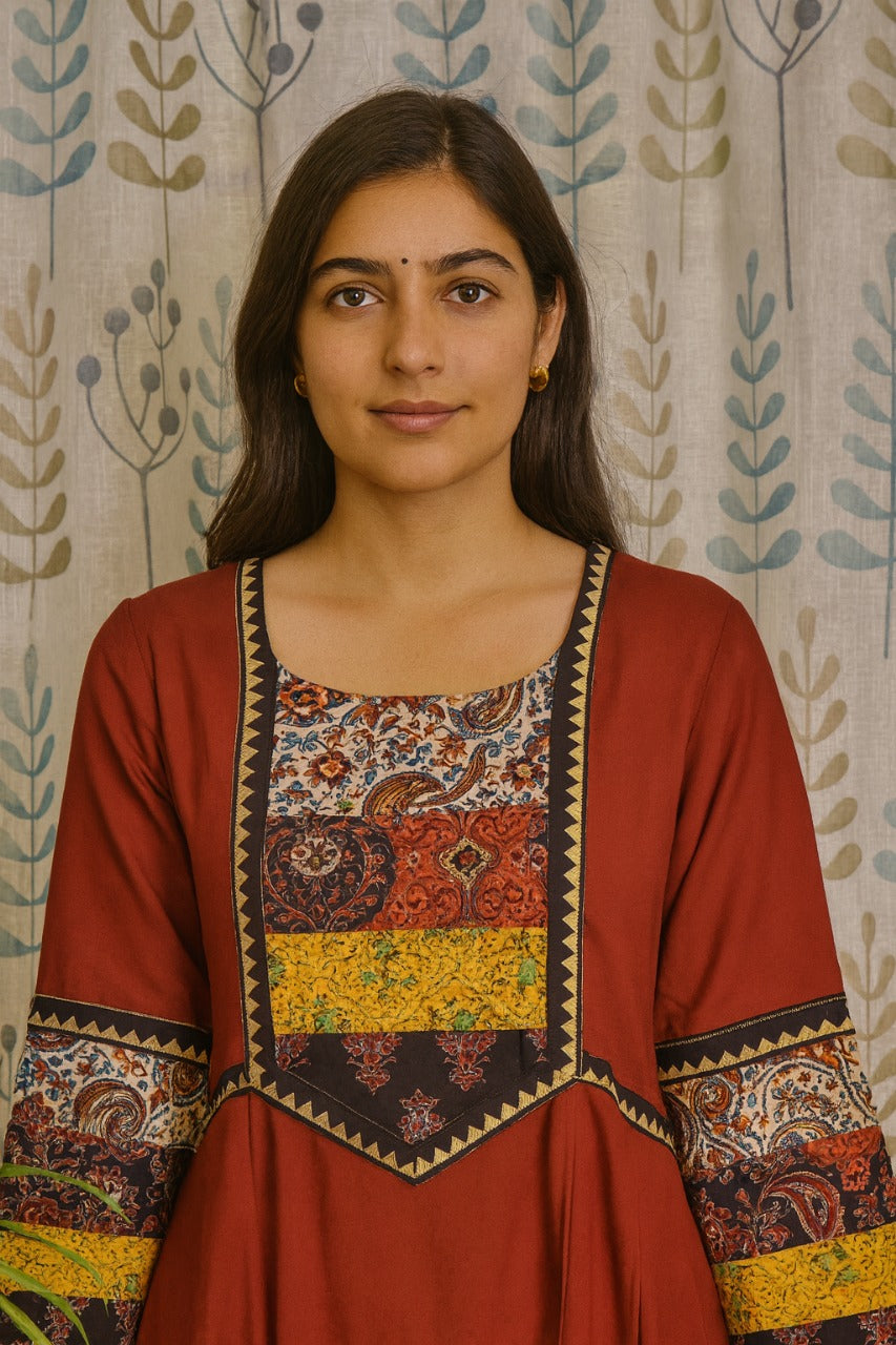 Flared maroon cotton kurti with round neck and artisan print