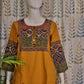 Handcrafted yellow kurti with mirror work and artisan-inspired design