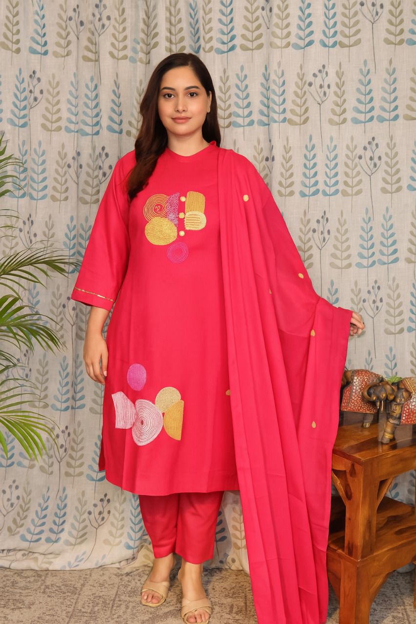 Front view of rani pink cotton kurti with embroidery and plain pants