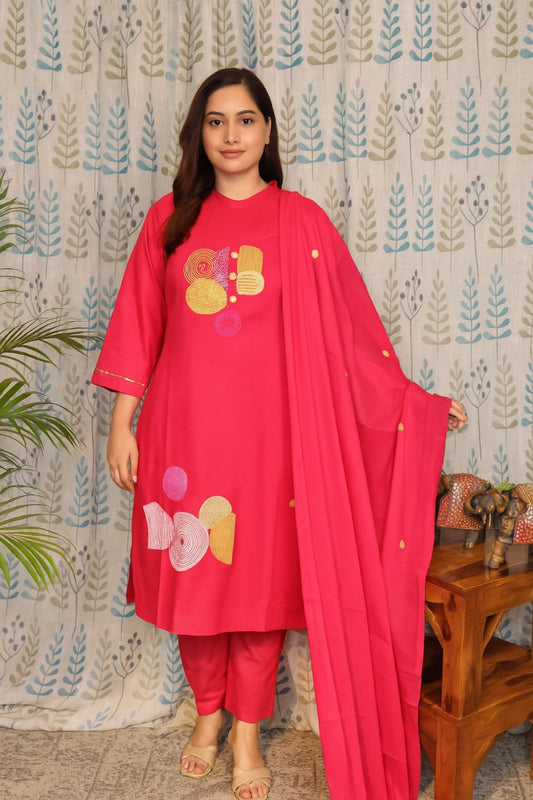 Front view of rani pink cotton kurti with embroidery and plain pants