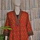 Elegant maroon kurti featuring 3/4 sleeves and mirror-embellished neckline
