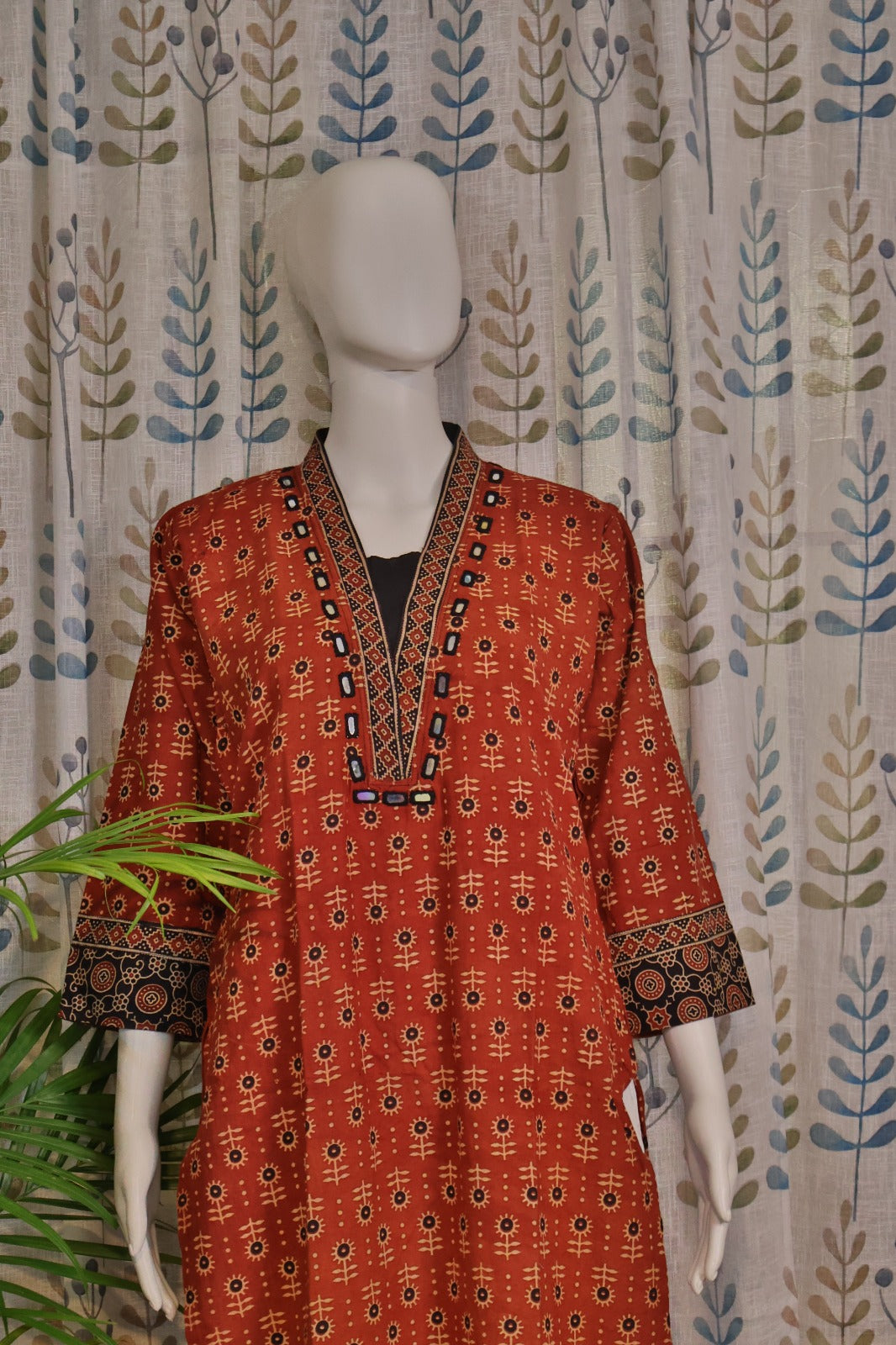Elegant maroon kurti featuring 3/4 sleeves and mirror-embellished neckline
