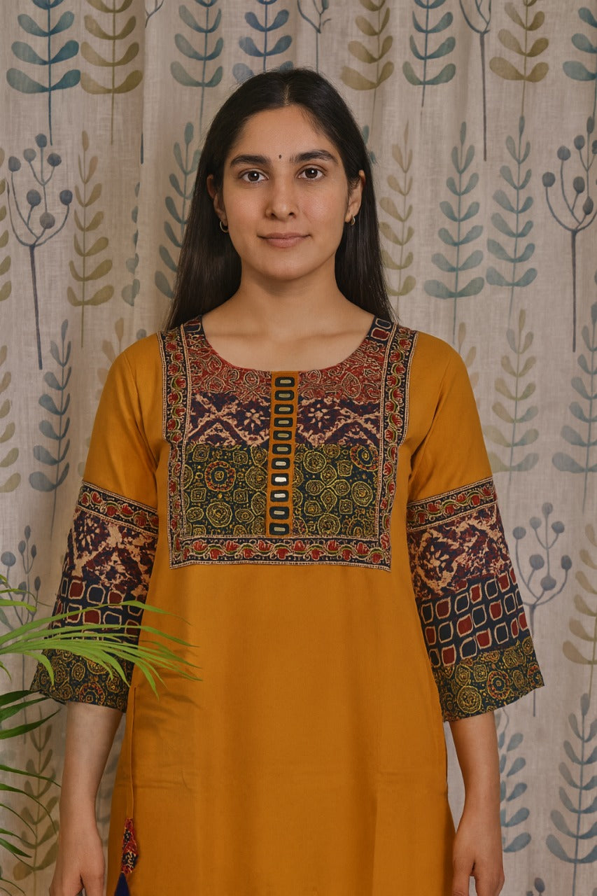 Yellow cotton kurti featuring adjustable tassels for hip fitting and comfort