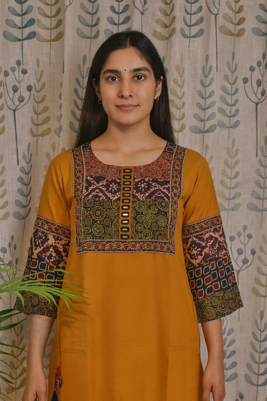 Yellow cotton kurti featuring adjustable tassels for hip fitting and comfort